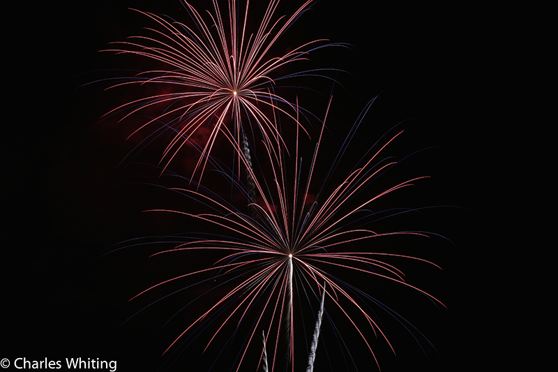 Fireworks light the night sky over LoDo Denver on Independence Day 2012