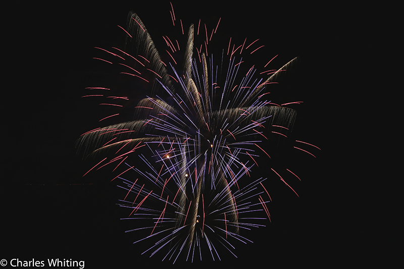 Fireworks light the night sky over LoDo Denver on Independence Day 2012