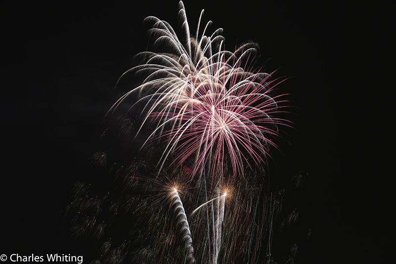 Fireworks light the night sky over LoDo Denver on Independence Day 2012