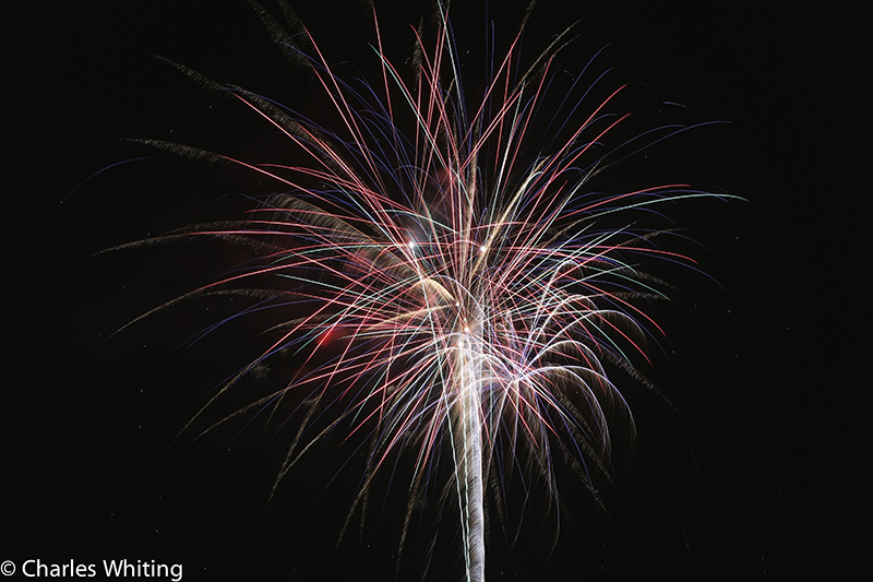 Fireworks light the night sky over LoDo Denver on Independence Day 2012