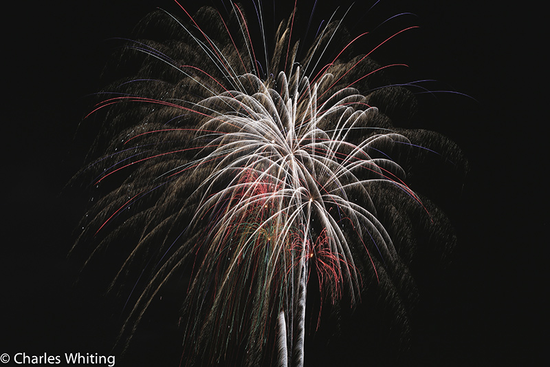 Fireworks light the night sky over LoDo Denver on Independence Day 2012