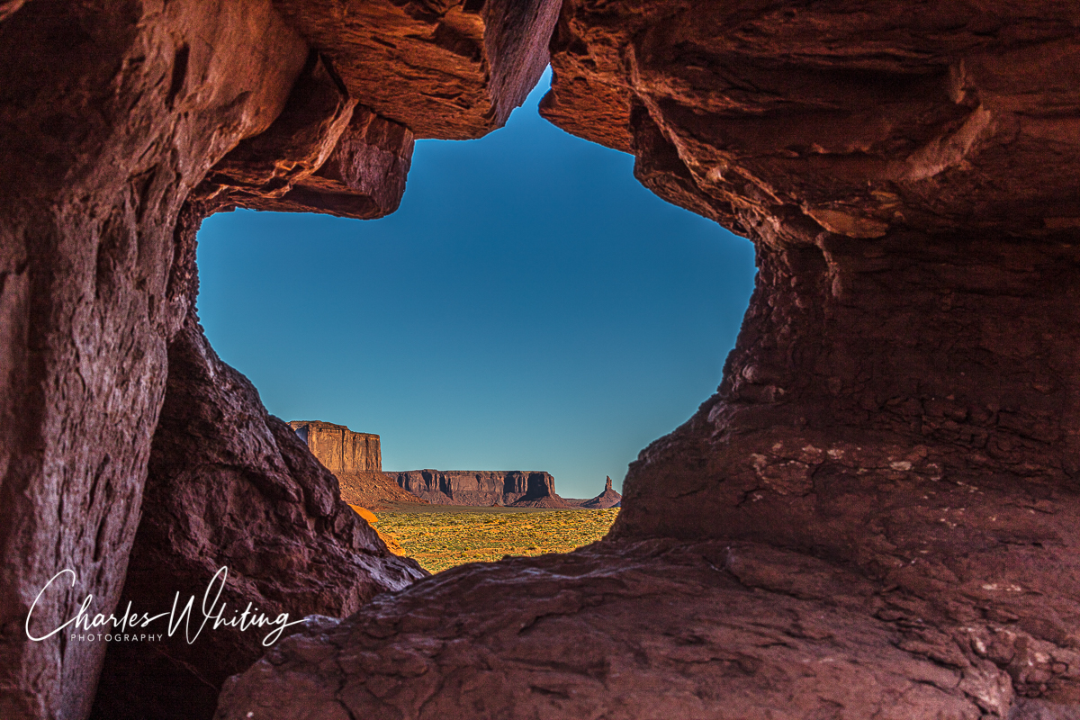 Buttes at Sunset Framed by a Rock Window, Monument Valley, Arizona