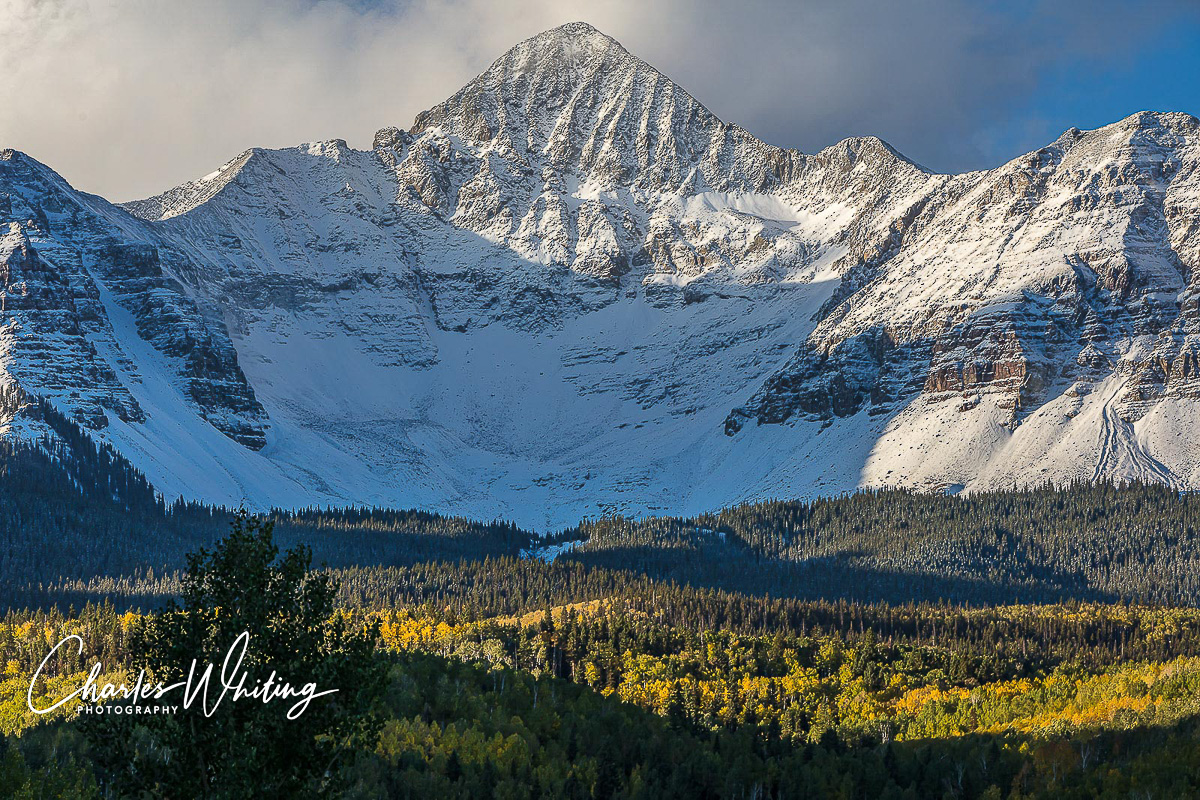 The first light of the day shines on Wilson Peak after an early Fall snow storm, San Miguel County, Colorado&nbsp;