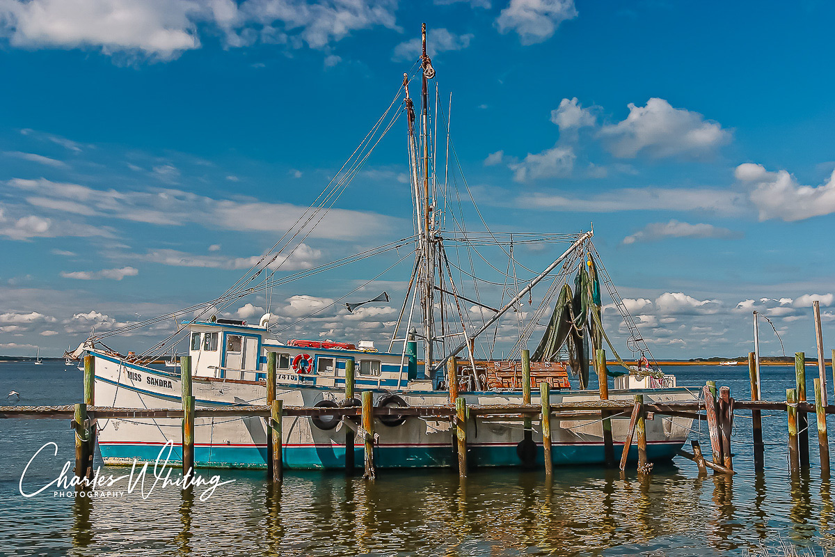 This aging workhorse of a fishing boat is a tangle of masts, cables, booms, nets and lobster traps