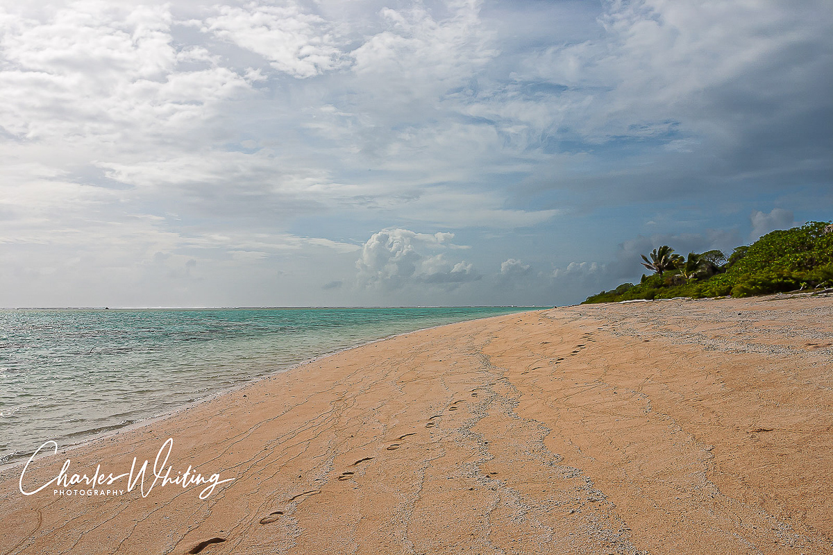 Solitary footprints on the red sand of Bikirose Beach
