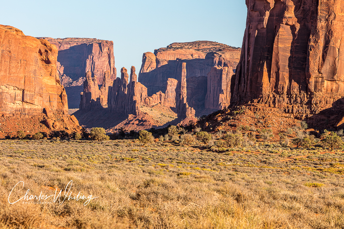 Late afternoon image of Totem Pole and Yei Bi Chi rock formations at the Monument Valley Navajo Tribal Park